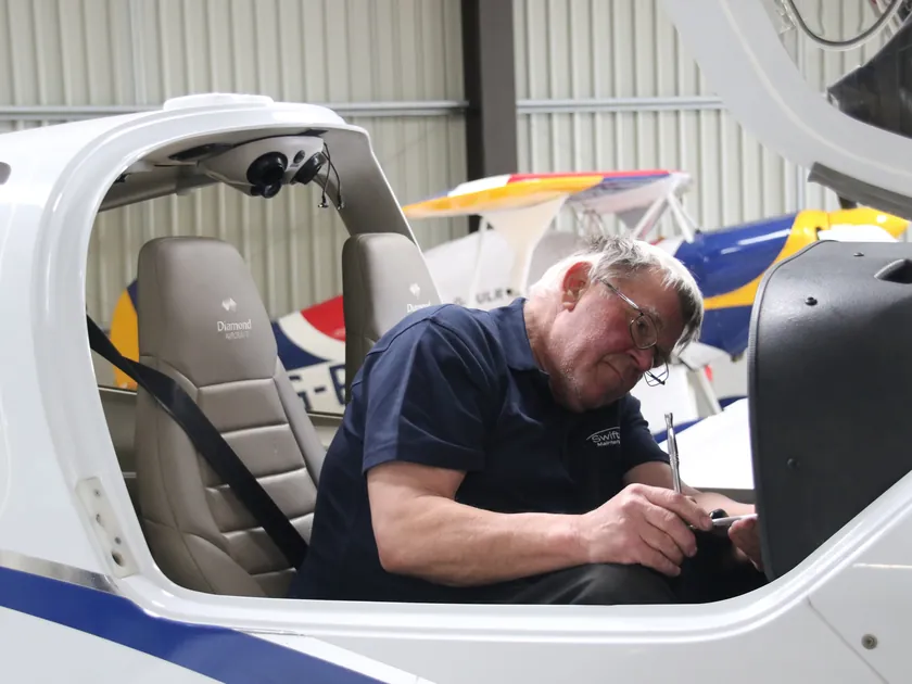Swift Aero engineer working in the cockpit of a Diamond aircraft